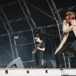 Yard Act performing on a festival stage